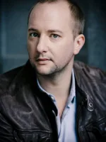 Tjark Bernau performing on stage in a European theatre production