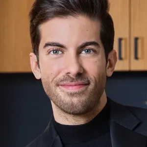 Luis D. Ortiz smiling at a real estate event