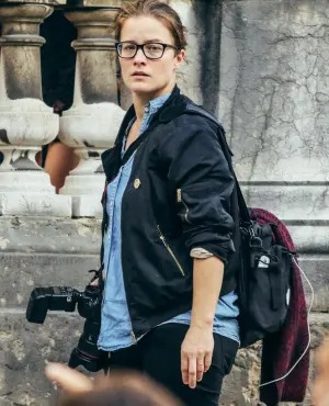 Portrait of Soazig de La Moissonnière holding a camera