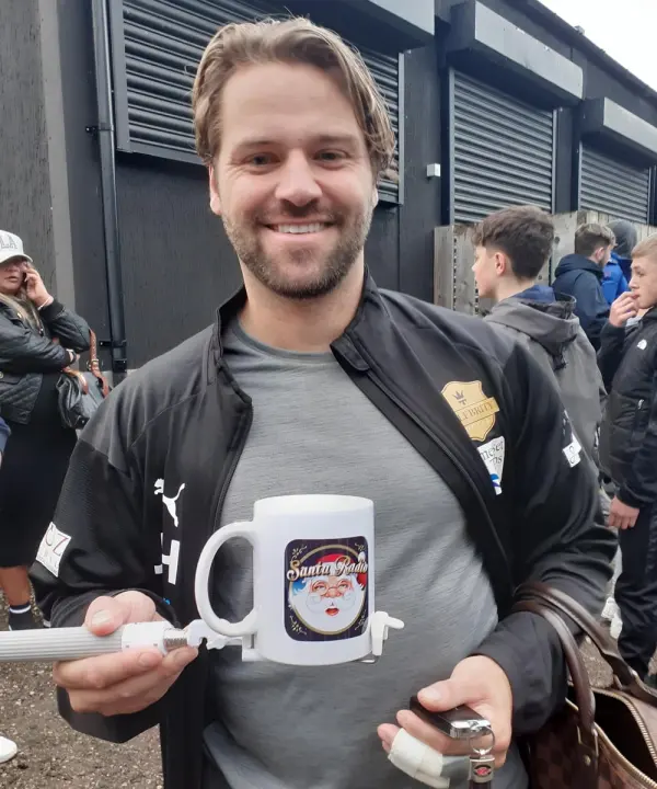 James Hill British television personality smiling on red carpet