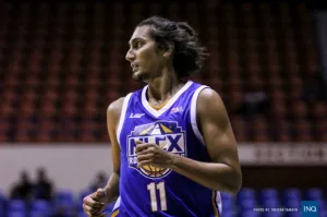Alex Mallari playing basketball on court