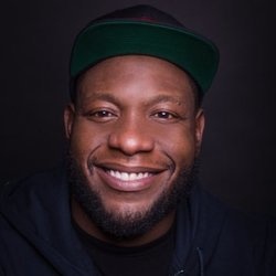 Brad Sativa performing stand-up comedy on stage