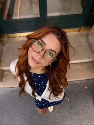 Catherain, also known as CandidCath, smiling while filming her candid lifestyle content