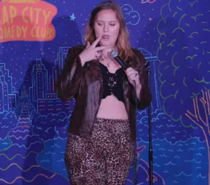 Liz Splatt, also known as Coveredinliz, performing comedy and connecting with her online audience.