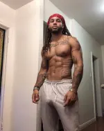 FlashmanWade posing confidently in a modern lifestyle setting