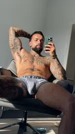 George Morcos posing confidently in a stylish setting, reflecting his influencer lifestyle