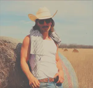 Colton Dowling smiling during a comedy performance