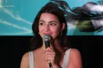 Jenny Gorelick smiling during a comedy performance, reflecting her vibrant and confident online persona