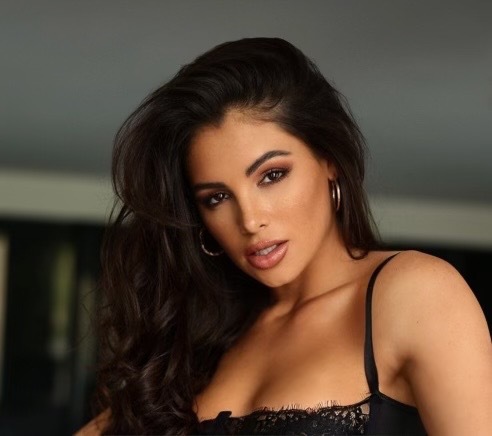 Kayla 🌶️ posing confidently as a digital creator and OnlyFans model