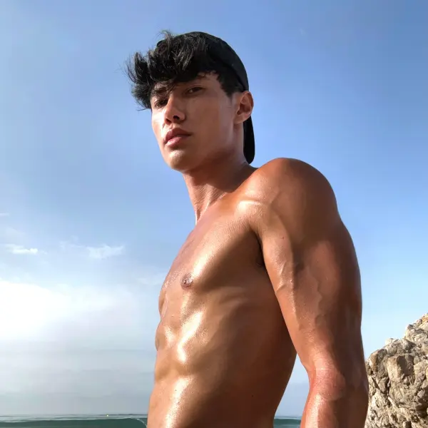 Alex James posing in stylish attire, representing his OnlyFans and influencer brand.