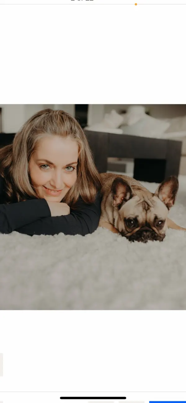 Michelle and her French Bulldog Mila posing for social media content