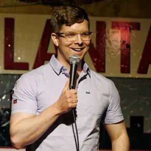 Jacob Williams, known as mrjacobwilliams, smiling in a candid photo from his comedy career.