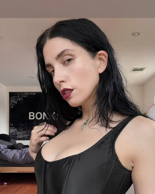 Nadya Riot posing with bold expression and artistic style for social media portrait
