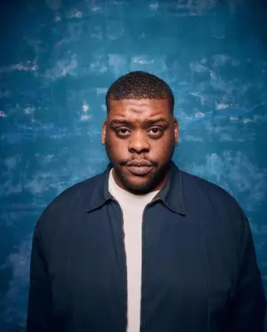 Napoleon Emill performing stand-up comedy on stage