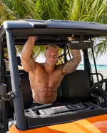 Nathan Webb, British fitness model and OnlyFans creator, posing confidently in a modern lifestyle setting.