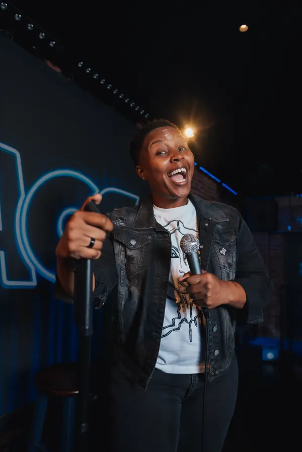 Portrait of Kalea McNeill, known as whateverkalea, smiling confidently.