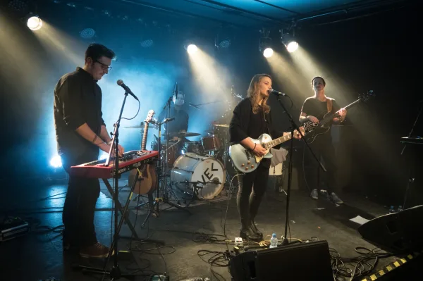 AVEC performing live at a concert stage