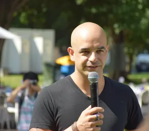 Adriano Zumbo Australian pastry chef smiling in kitchen