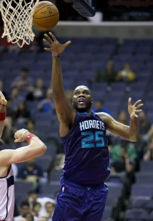 Al Jefferson playing basketball for the Charlotte Hornets