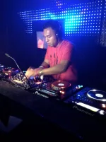 DJ IDeaL performing live at an electronic music festival