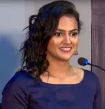 Shraddha Srinath smiling at a public event
