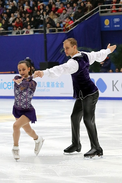 Jessica Pfund performing a figure skating routine on ice