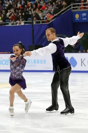 Jessica Pfund performing a figure skating routine on ice