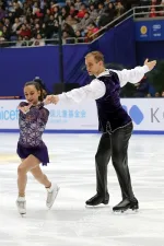Jessica Pfund performing a figure skating routine on ice