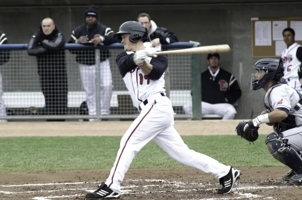 Marcus Knecht Canadian baseball player swinging bat